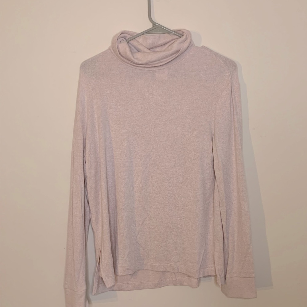 Beige turtleneck. Soft can easily dress up or for lounging.